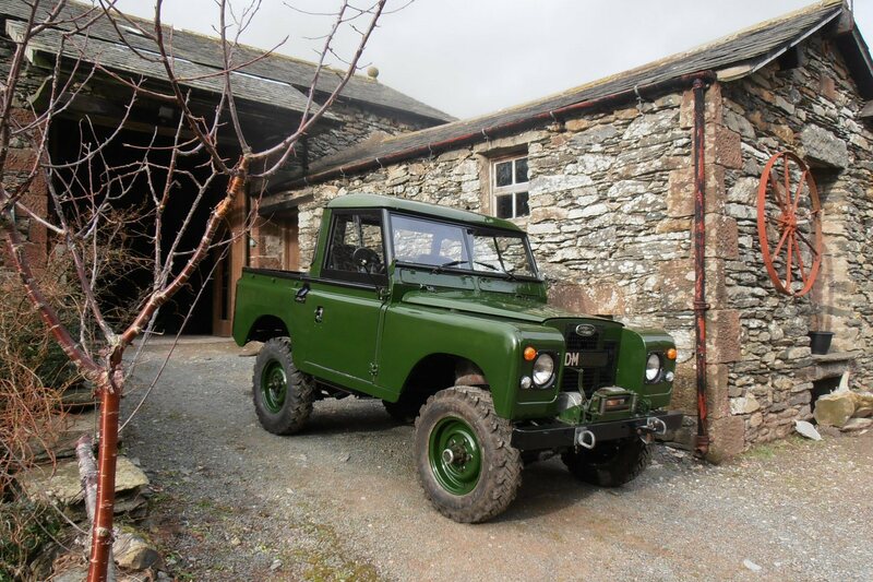 Restored green Series 2a Land Rover.
