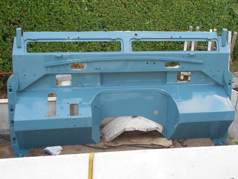 Land Rover Series 3 bulkhead painted in blue viewed from the front. 