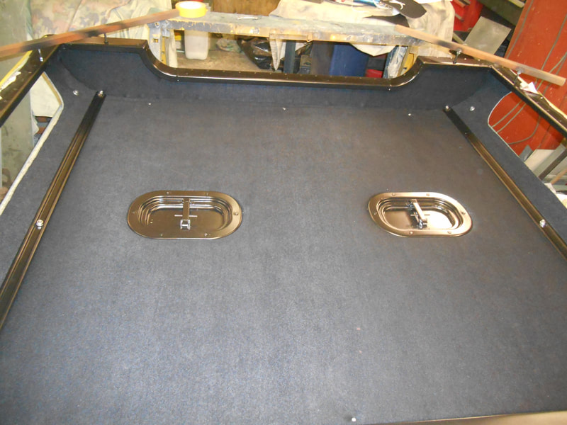 Rear roof lining and roof vents fitted in a Land Rover Series 2a Safari Roof.