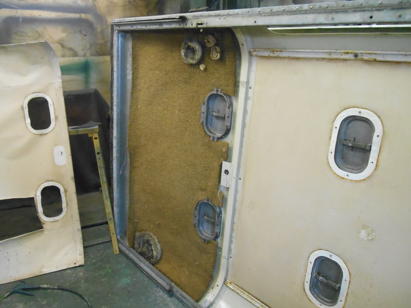 Inside of a Land Rover Series 2a Safari Roof after Cab roof lining has been removed revealing wasp/hornet nests.