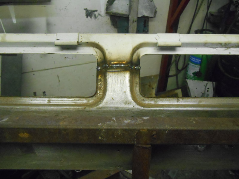 Top and bottom rail welded together on a  Land Rover Series 2a bulkhead.
