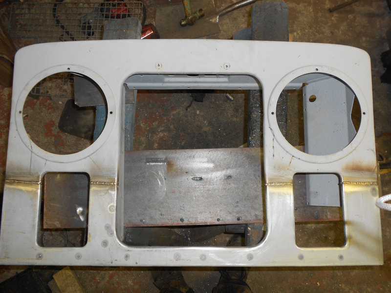 Old top half and new bottom half welded together to form a Land Rover Series 2 Front Panel.