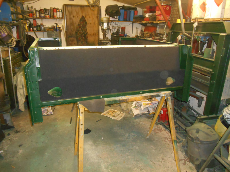 Land Rover Series 2a front of Tub bulkhead carpeted.