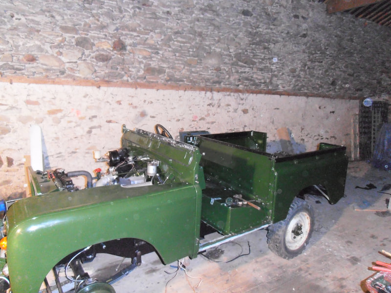 Side view of Green Land Rover Series 2a without roof, doors and windscreen. 