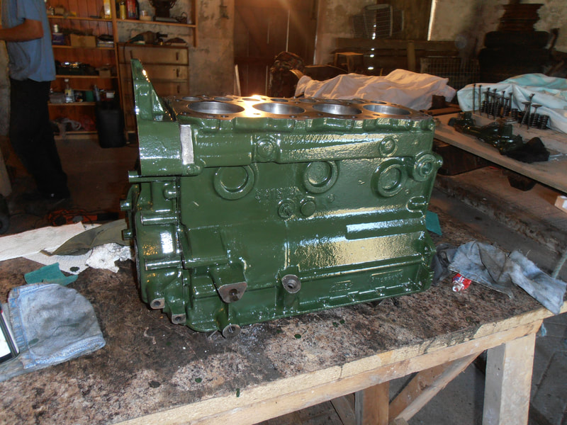 Land Rover Engine Block on table, freshly painted in green.