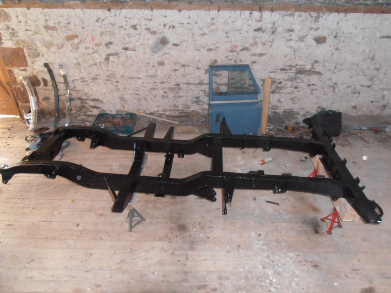 Land Rover Series 2a Axle after having been painted in black, viewed from the side.